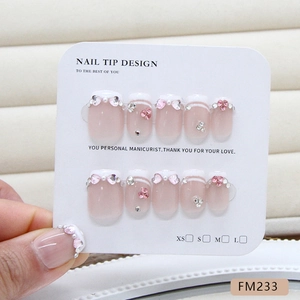 French style press-on nails with pink heart rhinestones and pearl accents in multiple sizes