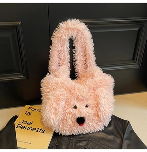 Detailed texture of pink plush tote bag in cute poodle dog shape with soft faux fur