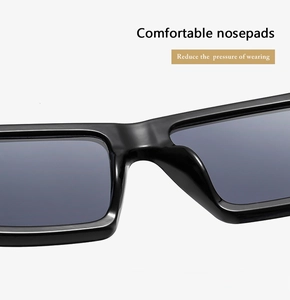 Close-up of comfortable integrated nose pads on black minimalist sunglasses frame
