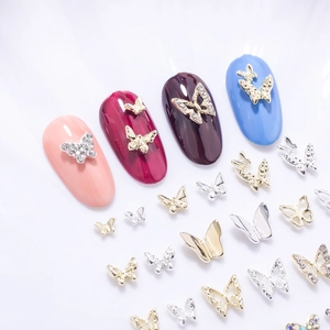 3D metallic butterfly nail art charms in gold and silver with rhinestones and hollow designs