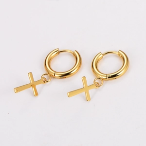 Detail view of gold stainless steel hoop earrings with minimalist cross pendants