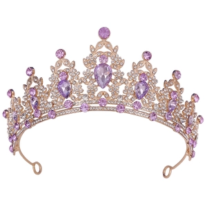 Detail of gold leaf headband with purple pear-shaped crystals and sparkling rhinestones