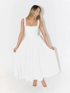 Detail of elegant white midi dress with square neckline and structured corset-style waist