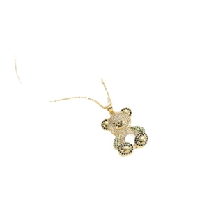 Golden teddy bear pendant necklace with white and green zircons on minimalist chain