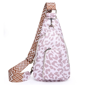 Macro shot of faux leather texture and leopard print on purple crossbody chest bag