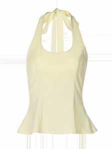 Detailed view of pale yellow halter neck top featuring elegant ruffled hemline and smooth fabric