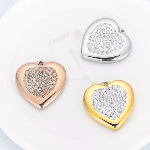 Three heart pendants in gold, silver and rose gold with sparkling zircon stones