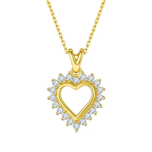 Macro shot of gold heart pendant necklace featuring sparkling zircon pave settings