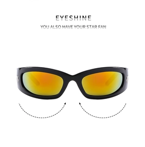 Detail of Y2K wraparound sunglasses with black frame and orange gradient lenses