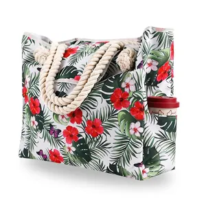 Detail of the durable rope handle and side pocket on this floral beach tote bag