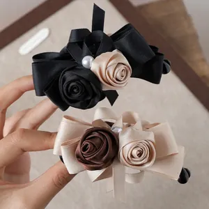 Elegant vintage rose and pearl bow banana hair clip in black and beige silk satin finish