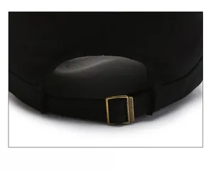 Detail of adjustable metal buckle and black cotton fabric on the back of the men's cap
