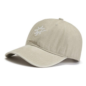Washed cotton baseball cap in sand khaki with sun embroidery and curved brim