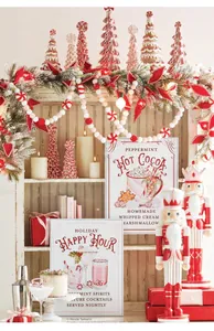 Vintage peppermint hot cocoa and holiday happy hour signs in a festive setting