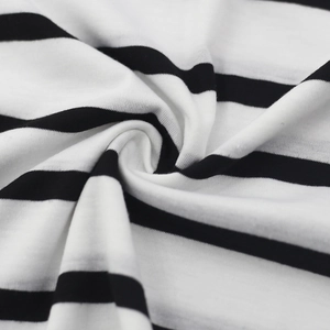 Close-up of soft black and white striped knit fabric showing texture and drape