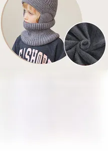 Detail showing thick fleece lining and tight knit texture of the gray kids winter hat