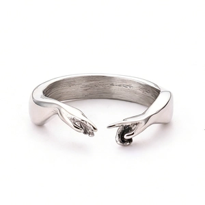 Artistic silver open ring featuring 'Hand of God' design with a polished metal finish