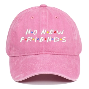 Detail of pink washed cotton baseball cap featuring No New Friends colorful embroidery