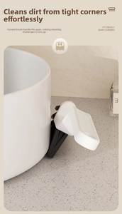 L-shaped crevice brush with stiff bristles cleaning bathroom tile gaps and corners