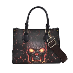 Gothic skull tote bag with orange fiery eyes and red lava cracks on black PU leather