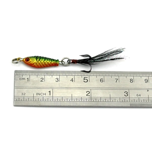 Mini bionic lead fish lure with vibrant scales and feathered treble hook on white background