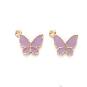 Macro view of purple enamel butterfly charms with gold metal edges for DIY jewelry making