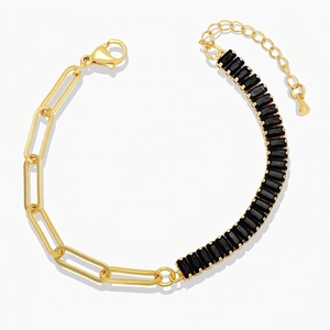 Close-up of gold chain bracelet with rectangle black zircon stones and lobster clasp