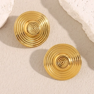 Macro detail of gold plated 18K stainless steel tiered concentric circle stud earrings