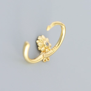 925 sterling silver gold sunflower hoop earring with crystal center on grey background