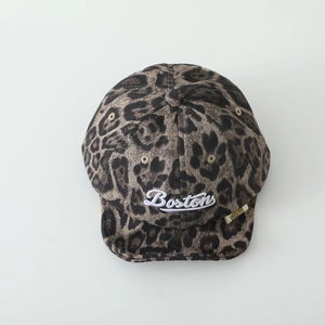 Macro detail of leopard print baby baseball cap featuring white Bostons embroidery