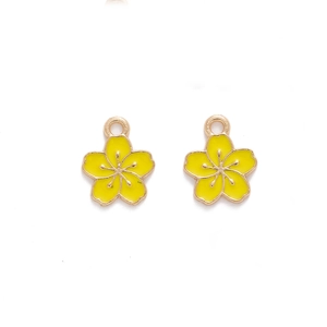 Detailed close-up of yellow enamel cherry blossom charms with golden metal edges