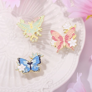 Enamel flower butterfly brooches in green moth and pink blue butterfly designs