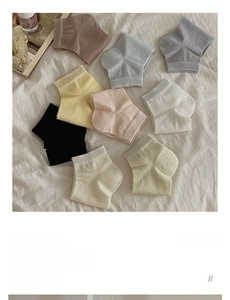 Detail of colorful silk blend socks in nine pastel shades with ribbed texture