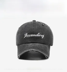 Close-up of Ascending embroidery and distressed details on a vintage washed baseball cap