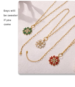 Detailed view of colorful enamel snowflake pendants with sparkling zircon and gold chain