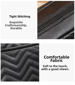 Close-up of premium black leather with V-quilted pattern and durable metal zipper detail