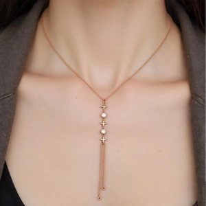 Elegant rose gold stainless steel necklace and bracelet set with tassel star pendants