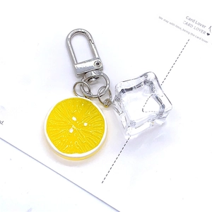 Creative lemon slice and ice cube keychain charm with yellow resin fruit detail