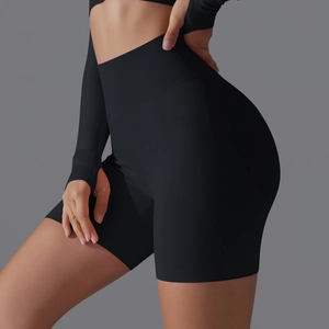 Detail view of high-waist black seamless yoga shorts with textured rib knit fabric