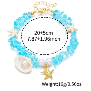 Blue gravel beaded bracelet with starfish and shell charms on a white background