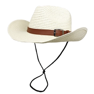 Detail of woven straw cowboy hat with brown leather buckle strap and adjustable wind rope
