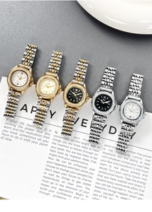 Detailed display of luxury women's quartz watches with rhinestone bezels and metal bands