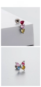 Detailed macro view of butterfly and heart zircon titanium steel screw back earrings