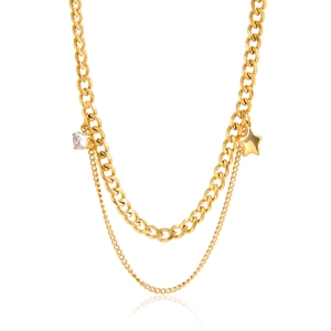 Detail of double-layer gold necklace with cubic zirconia and star charms on Cuban chain