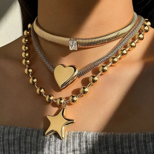 Gold layered stainless steel necklace with heart and star pendants and snake chain
