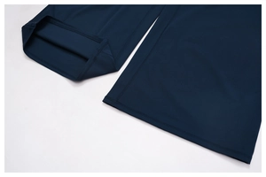 Detail shot of navy blue sports trousers featuring double-needle stitching at the hem