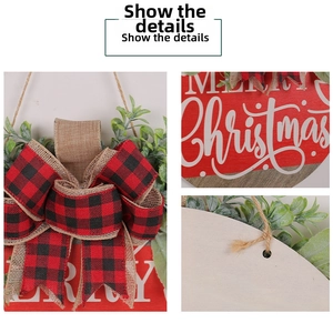 Close-up of wooden Merry Christmas sign with buffalo plaid bow and eucalyptus leaves