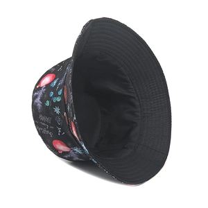 Detail of black Christmas bucket hat featuring festive snowflakes and holiday quote print
