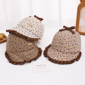 Vintage floral baby sun hat with brown ruffles and bow in beige and coffee colors