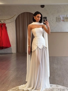 Detail of elegant white satin bodice with pearl waist embellishments and sheer tulle skirt